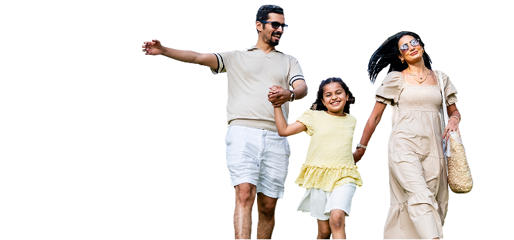Father and mother walking with daughter and smiling